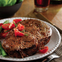 Ribeye Steaks with Sautéed Grape Tomatoes and Brie