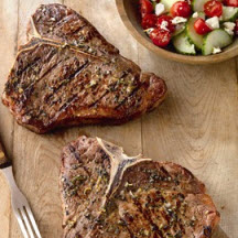Greek–Seasoned T-Bone Steaks with Tomato and Cucumber Salad