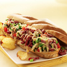 Pastrami Cheesesteaks with Piquanté Peppers, Caramelized Onions and Fontiago